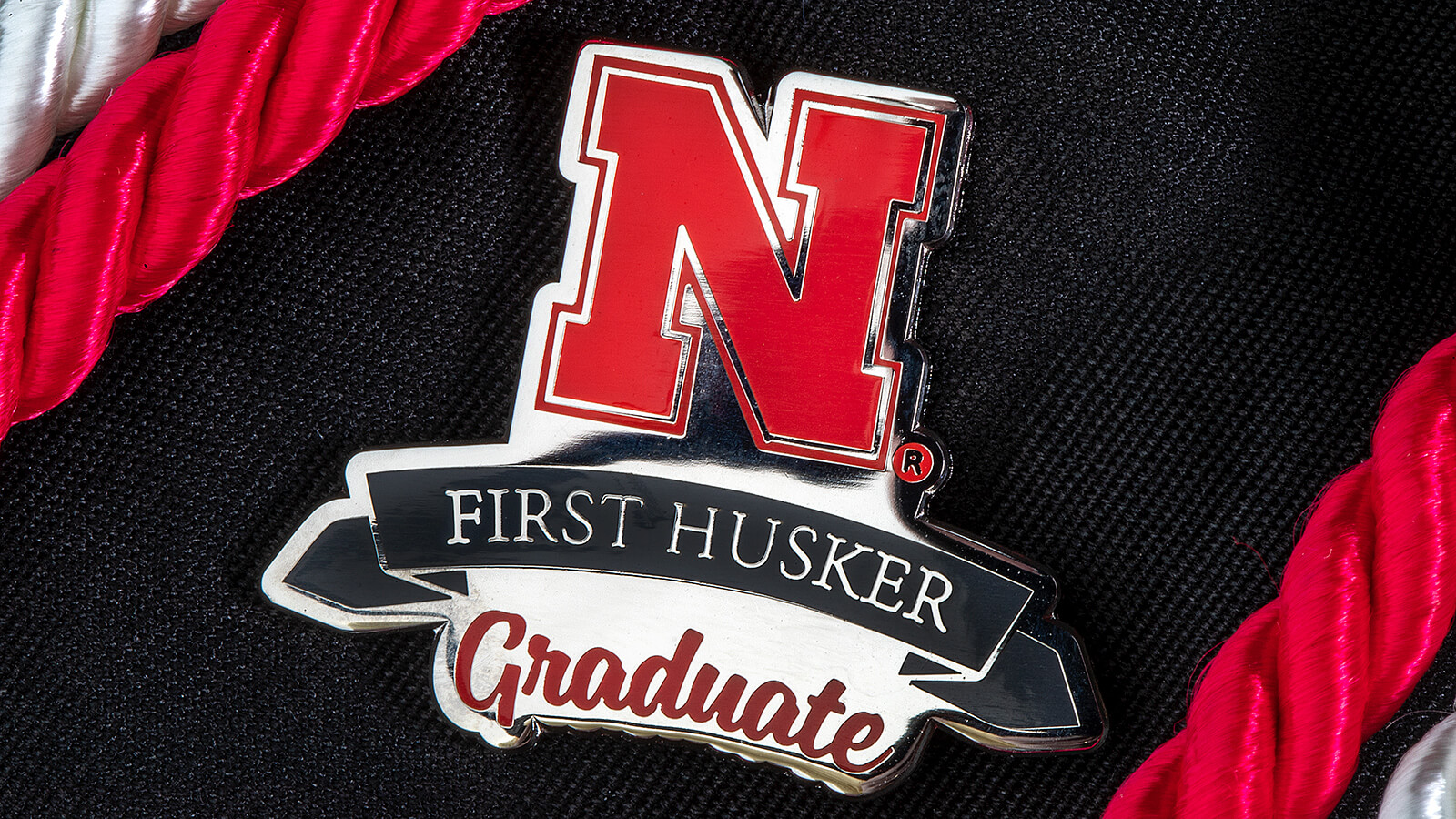 First Husker Graduate pin.